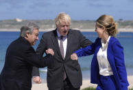 British Prime Minister Boris Johnson and his wife Carrie greet United Nations Secretary General Antonio Guterres, left, during arrivals for the G7 meeting at the Carbis Bay Hotel in Carbis Bay, St. Ives, Cornwall, England, Saturday, June 12, 2021. Leaders of the G7 gather for a second day of meetings on Saturday, in which they will discuss COVID-19, climate, foreign policy and the economy. (AP Photo/Kirsty Wigglesworth, Pool)