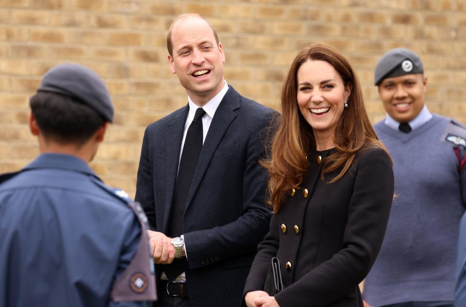Britain's Prince William, Duke of Cambridge, and Britain's Catherine, Duchess of Cambridge, wearing black as a mark of respect following the death of Britain's Prince Philip, Duke of Edinburgh, talk with Air Cadets during their visit to 282 (East Ham) Squadron Air Training Corps in east London on April 21, 2021. - During the visit, the Squadron paid tribute to The Duke of Edinburgh, who served as Air Commodore-in-Chief of the Air Training Corps for 63 years. In 2015, The Duke passed the military patronage to The Duchess of Cambridge who became Honorary Air Commandant. (Photo by Ian Vogler / POOL / AFP) (Photo by IAN VOGLER/POOL/AFP via Getty Images)