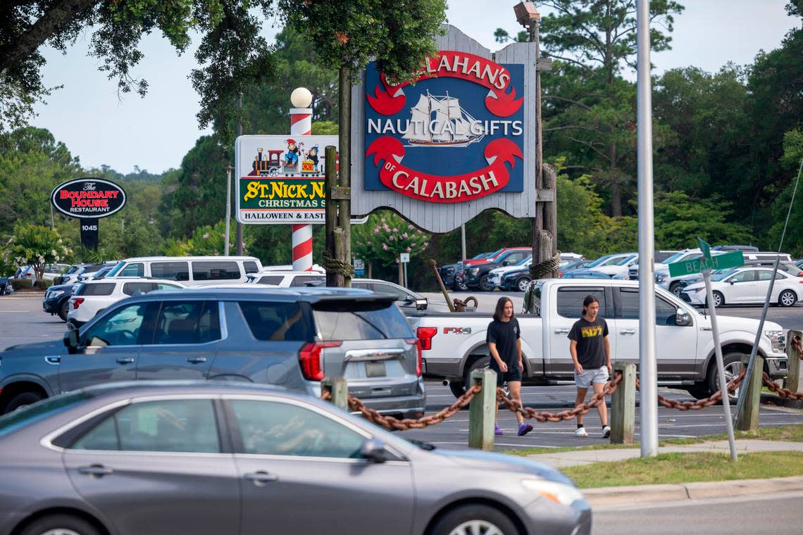 The parking lot of Callahan’s is completely full as vacationers visit the popular shop or one of the many seafood restaurants that line River Road on Friday, June 28, 2024 in Calabash, N.C.