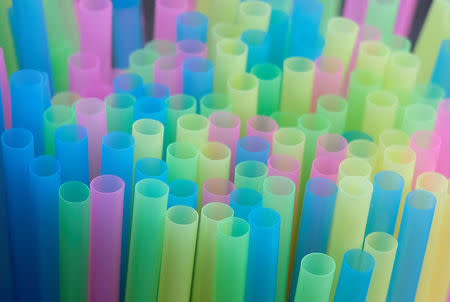 FILE PHOTO: Drinking straws protrude from a glass in a illustration picture in Loughborough, Britain April 19, 2018. REUTERS/Darren Staples/File Photo