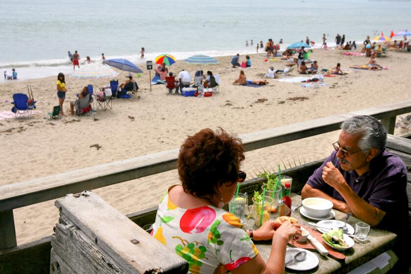 -- Pacific Palisades, CA -- July 6, 2008 -- Paul Flores, of Colvina, and Sandra Perez, of Walnut, enjoy their first outside meal at Gladstone's in Pacific Palisades on July 6, 2008. The two usually enjoy their meals inside the restaurant. ( Liz O. Baylen / Los Angeles Times )