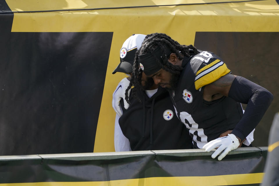 Pittsburgh Steelers wide receiver Diontae Johnson, right, walks off the field during the second half of an NFL football game against the San Francisco 49ers, Sunday, Sept. 10, 2023, in Pittsburgh. (AP Photo/Gene J. Puskar)