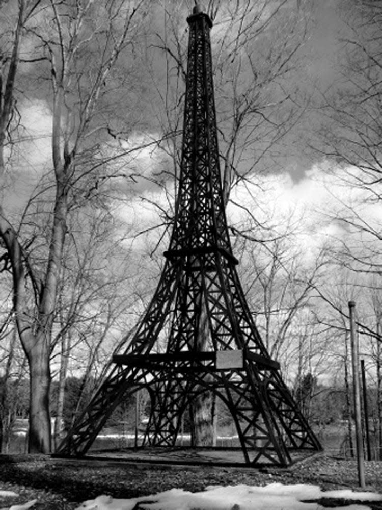 The town historical park in Paris features a  much smaller replica (20 feet) of  the Eiffel Tower (1,063 feet).