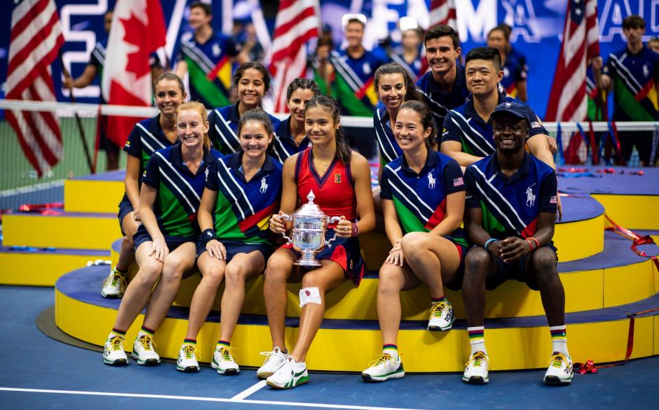 Raducanu celebrates with the US Open ball boys and girls - GETTY IMAGES