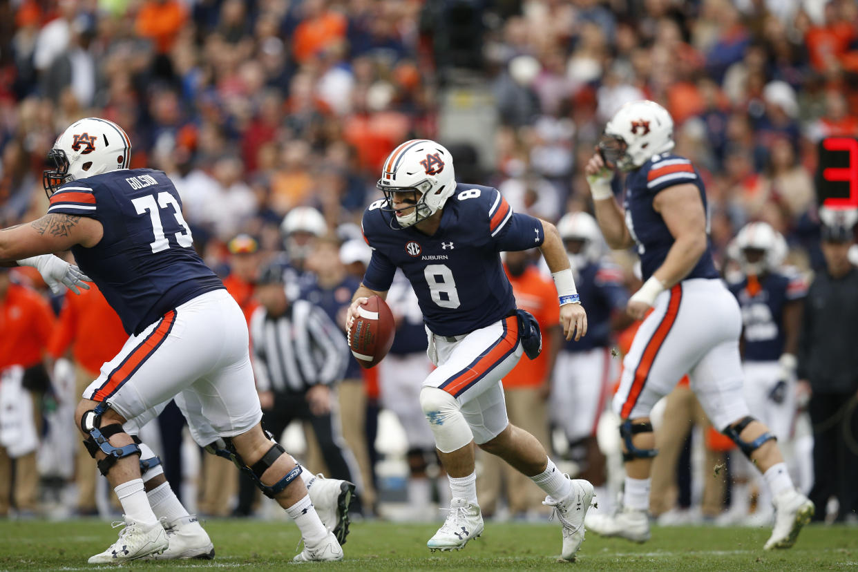 Auburn quarterback Jarrett Stidham (8) runs the ball during the first half of the Iron Bowl NCAA college football game against Alabama, Saturday, Nov. 25, 2017, in Auburn, Ala. (AP Photo/Brynn Anderson)