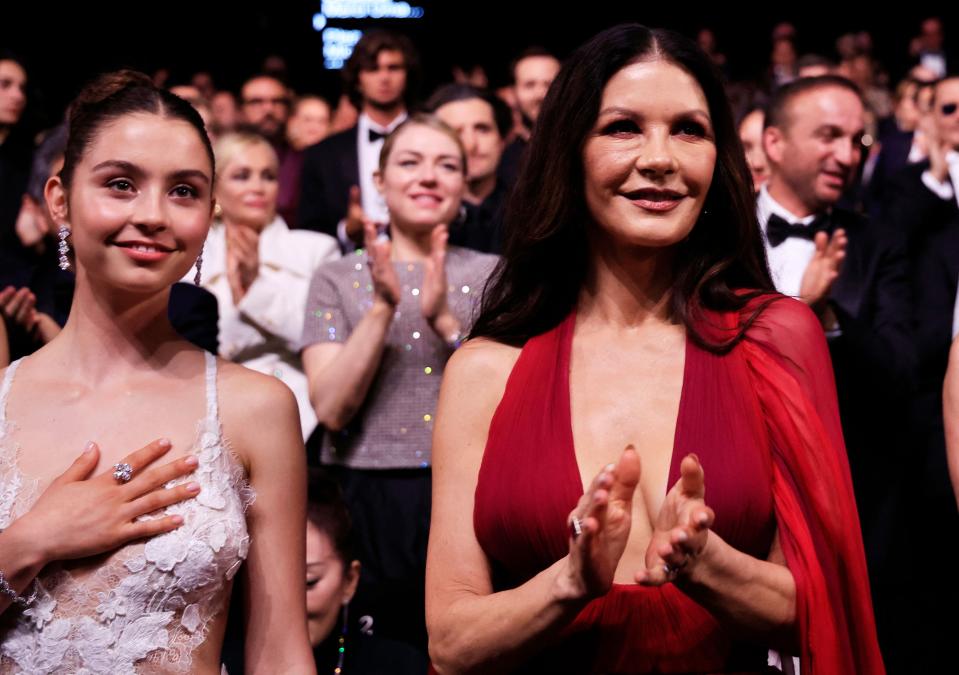 British actress Catherine Zeta-Jones (R) and her daughter Carys Zeta Douglas (L) attend the opening ceremony of the 76th edition of the Cannes Film Festival in Cannes, southern France, on May 16, 2023. (Photo by Valery HACHE / AFP) (Photo by VALERY HACHE/AFP via Getty Images) ORIG FILE ID: AFP_33FB4KG.jpg