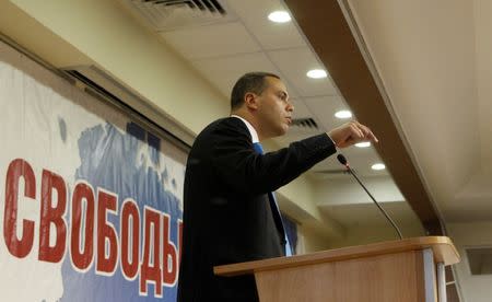 FILE PHOTO: Vladimir Milov, joint leader of opposition bloc Party of People's Freedom, addresses the audience during the party congress in Moscow, Russia September 24, 2011. The sign reads "Freedom". REUTERS/Grigory Dukor/File Photo