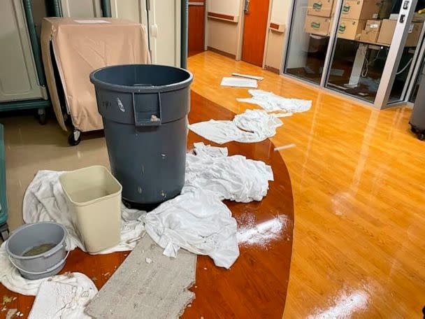 PHOTO: Various containers and clothes soak up floodwater near debris at an area at HCA Florida Fawcett Hospital in Port Charlotte, Fla., Sept. 28, 2022. (Dr. Birgit Bodine via AP)