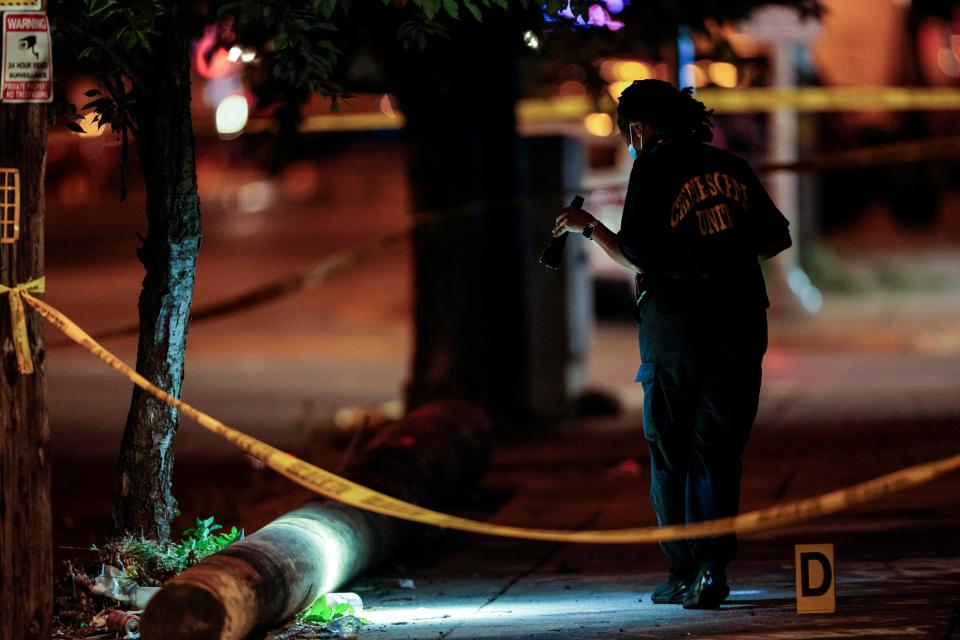 Police investigate the scene of a shooting Monday, July 3, 2023 in Philadelphia.