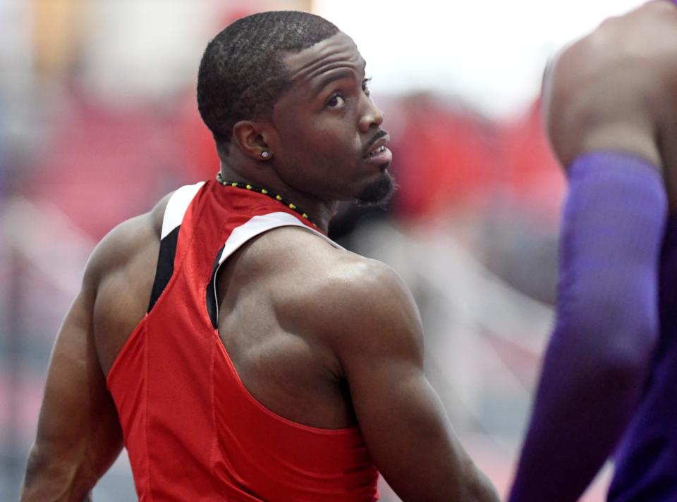 Texas Tech sprinter Don'Dre Swint checks his time after he ran in the 60 meters Friday. Swint finished third in 6.60 seconds.