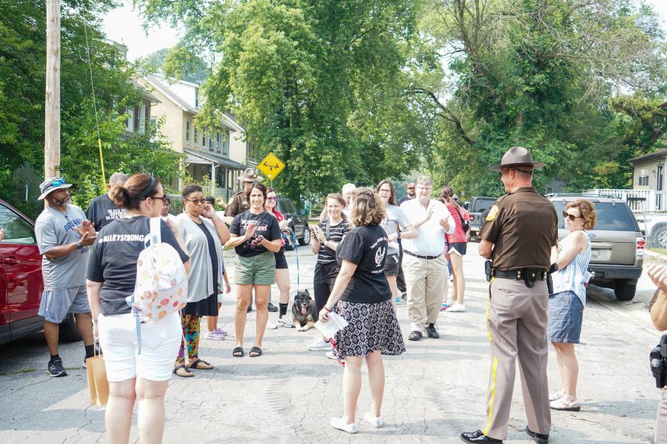 Community members gather in Knollwood for a peace walk on Thursday, June 29, 2023.