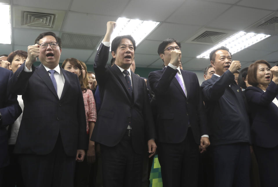 Taiwan's Vice President Lai Ching-te, also known as William Lai, second left in front, cheers during a press conference in Taipei, Taiwan, Wednesday, April 12, 2023. Taiwan’s pro-independence ruling Democratic Progressive Party nominated Lai as its candidate in the 2024 presidential election, two days after China concluded large-scale wargames around the self-governed island. (AP Photo/Chiang Ying-ying)