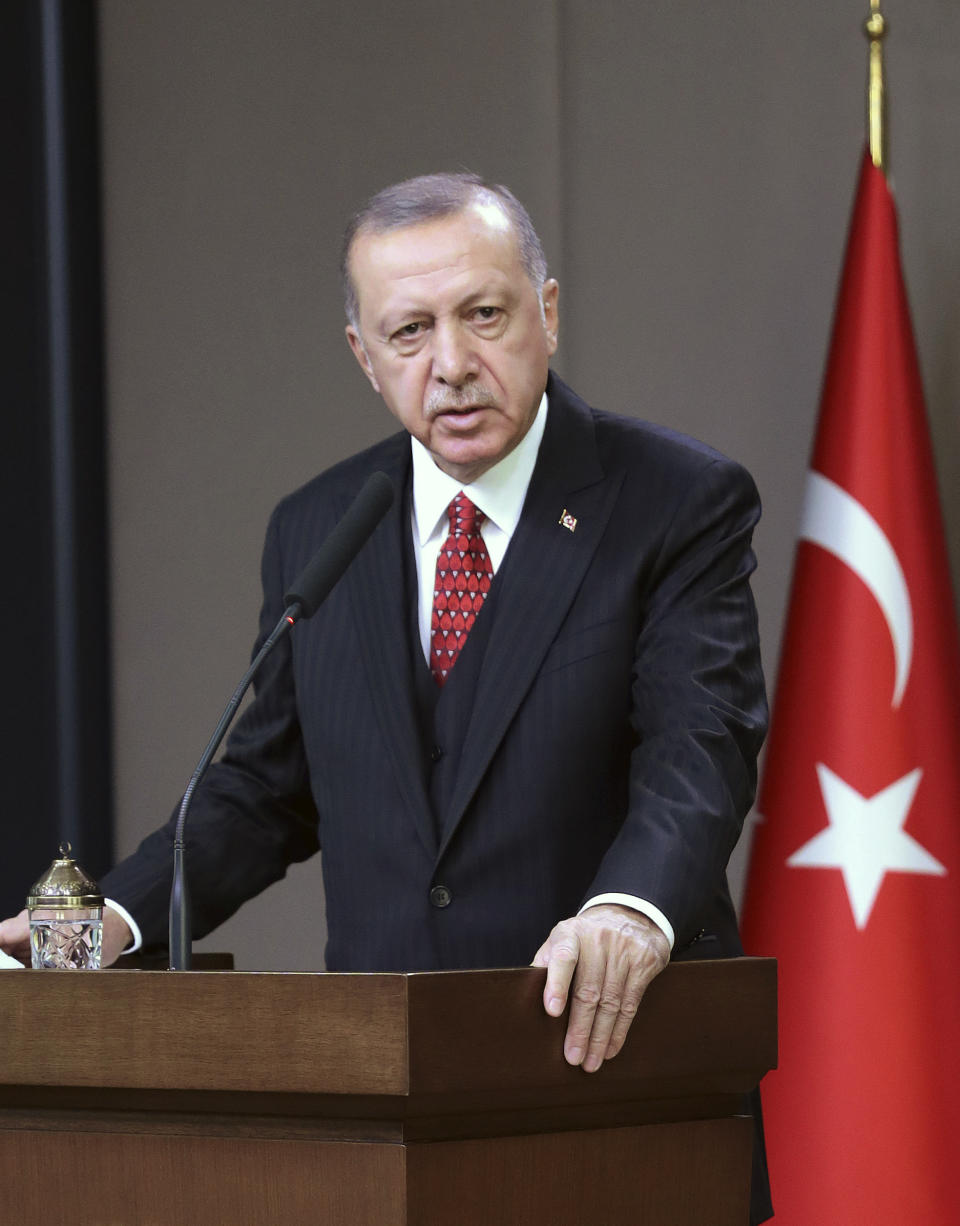 Turkey's President Recep Tayyip Erdogan talks during a news conference in Ankara, Turkey, Monday Oct. 7, 2019 prior to his departure for Serbia for an official visit. Erdogan says American troops have started withdrawing from positions in northern Syria, hours after the White House said that U.S. forces in northeast Syria will move aside and clear the way for an expected Turkish incursion. (Presidential Press Service via AP, Pool)