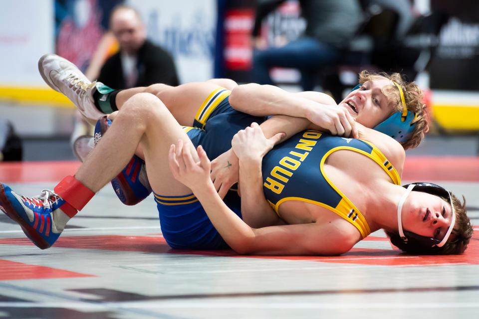 Northern Lebanon's Sam Wolford (rear) defeats Montoursville's Aristotlis Bobotas by tech fall, 15-0, during a 107-pound first round bout at the state championship. Wolford finished the tournament with a fourth-place medal.