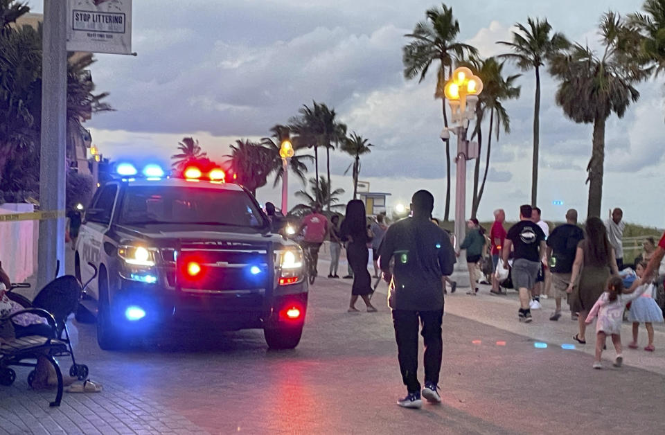 FILE - Police respond to a shooting near the Hollywood Beach Broadwalk in Hollywood, Fla., Monday evening, May 29, 2023. Recent high-profile mass shootings highlight what can be a deadly mix of teenage bravado and immaturity with growing access to high-powered guns that can kill faster and more efficiently than ever.(Mike Stocker/South Florida Sun-Sentinel via AP, File)