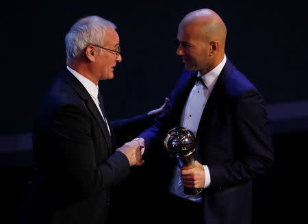 Soccer Football - The Best FIFA Football Awards - London Palladium, London, Britain - October 23, 2017 Real Madrid coach Zinedine Zidane is presented with The Best FIFA Men's Coach Award by Nantes coach Claudio Ranieri during the awards REUTERS/Eddie Keogh