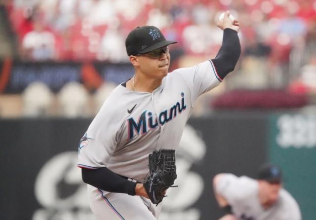 First base coach Jon Jay of the Miami Marlins stands on the field