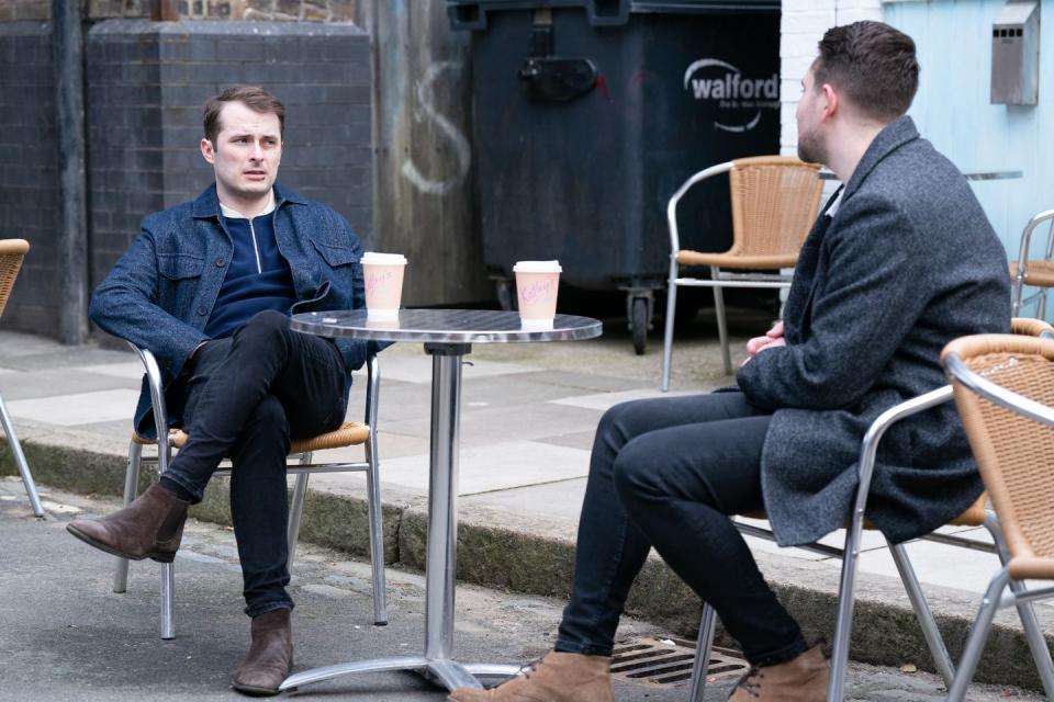 <p>They sit outside the cafe. </p>