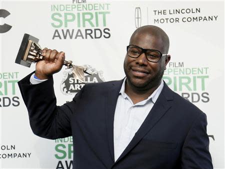 Director Steve McQueen poses backstage with his Best Feature award for the film "12 Years a Slave" at the 2014 Film Independent Spirit Awards in Santa Monica, California March 1, 2014. REUTERS/Danny Moloshok