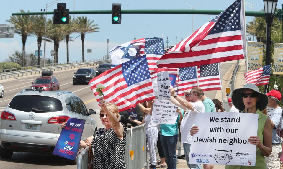 Protesters stand in solidarity with the Jewish community, Saturday, April 22, 2023, at Granada Boulevard and Beach Street in front of Ormond Beach City Hall.