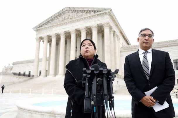 PHOTO: Kathay Feng and attorney Neal Katyal, speak to the media following oral arguments in Moore v. Harper, a Republican-backed appeal to curb judicial oversight of elections, in Washington, Dec. 7, 2022. (Evelyn Hockstein/Reuters)