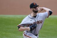 San Francisco Giants starting pitcher Alex Wood throws to a Texas Rangers batter during the first inning of a baseball game in Arlington, Texas, Tuesday, June 8, 2021. (AP Photo/Tony Gutierrez)