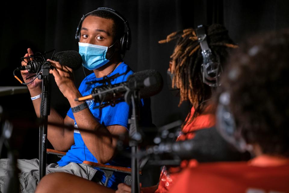 Branden Lewis, left, discusses gun violence while recording an episode of the podcast “Stitchcast Studio” at the Grandel Theatre in St. Louis on Aug. 13.