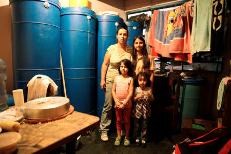 Yaneidi Guzman poses for a picture next to her daughters, Esneidy Ramirez (R), (front L-R) Steffany Perez and Fabiana Perez, at their home in Caracas, Venezuela, April 22, 2016. REUTERS/Carlos Garcia Rawlins