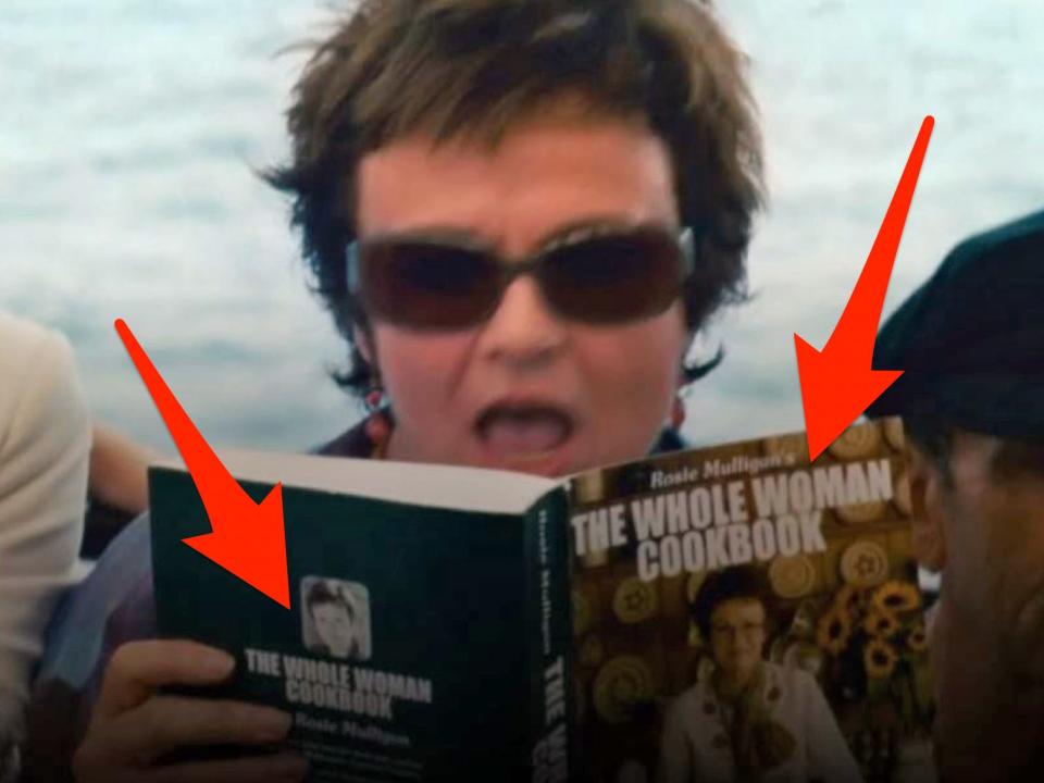 red arrows pointing to the front and back of rosie's cookbook in an opening scene of mamma mia