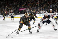 Vegas Golden Knights center Jonathan Marchessault (81) skates against Edmonton Oilers defenseman Darnell Nurse (25) during the second period of an NHL hockey game Friday, Oct. 22, 2021, in Las Vegas. (AP Photo/Steve Marcus)