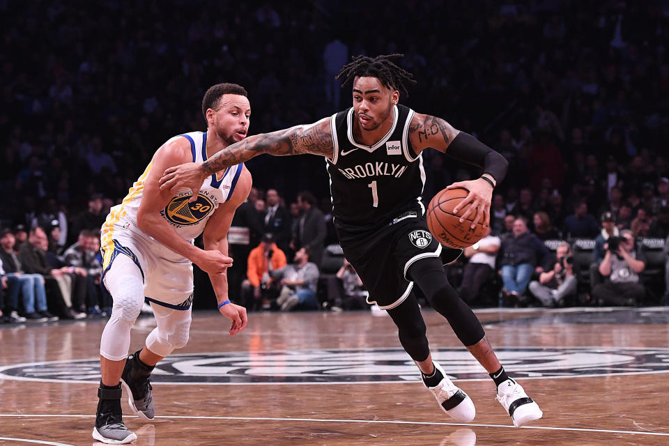 NEW YORK, NY - OCTOBER 28: D'Angelo Russell #1 of the Brooklyn Nets drives to the basket against Stephen Curry #30 of the Golden State Warriors during the game at Barclays Center on October 28, 2018 in the Brooklyn borough of New York City. NOTE TO USER: User expressly acknowledges and agrees that, by downloading and or using this photograph, User is consenting to the terms and conditions of the Getty Images License Agreement. (Photo by Matteo Marchi/Getty Images)