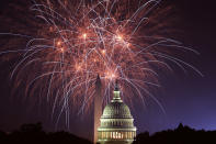 <p>Fireworks explode overhead at the U.S. Capitol and the Washington Monument on Independence Day July 4, 2018 in Washington, D.C. (Photo: Alex Wong/Getty Images) </p>