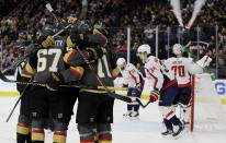 Vegas Golden Knights left wing Max Pacioretty (67) celebrates with teammates after scoring against the Washington Capitals during the second period of an NHL hockey game Monday, Feb. 17, 2020, in Las Vegas. (AP Photo/Isaac Brekken)