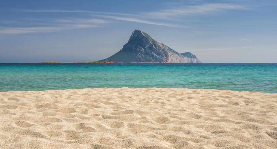 The beach of Porto Taverna with Tavolara Island - North-eastern Sardinia, Italy.