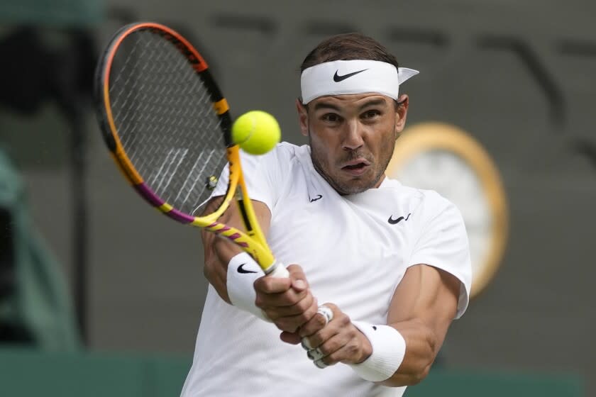 Spain's Rafael Nadal returns the ball to Italy's Lorenzo Sonego during a third round men's singles match on day six of the Wimbledon tennis championships in London, Saturday, July 2, 2022. (AP Photo/Alastair Grant)