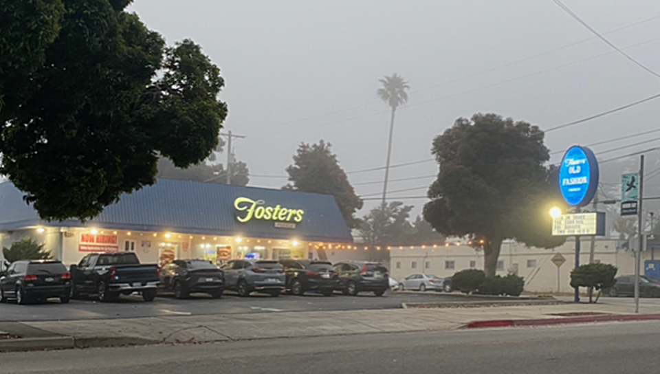 The Fosters Freeze restaurant in Morro Bay seems to shimmer in the misty dusk.