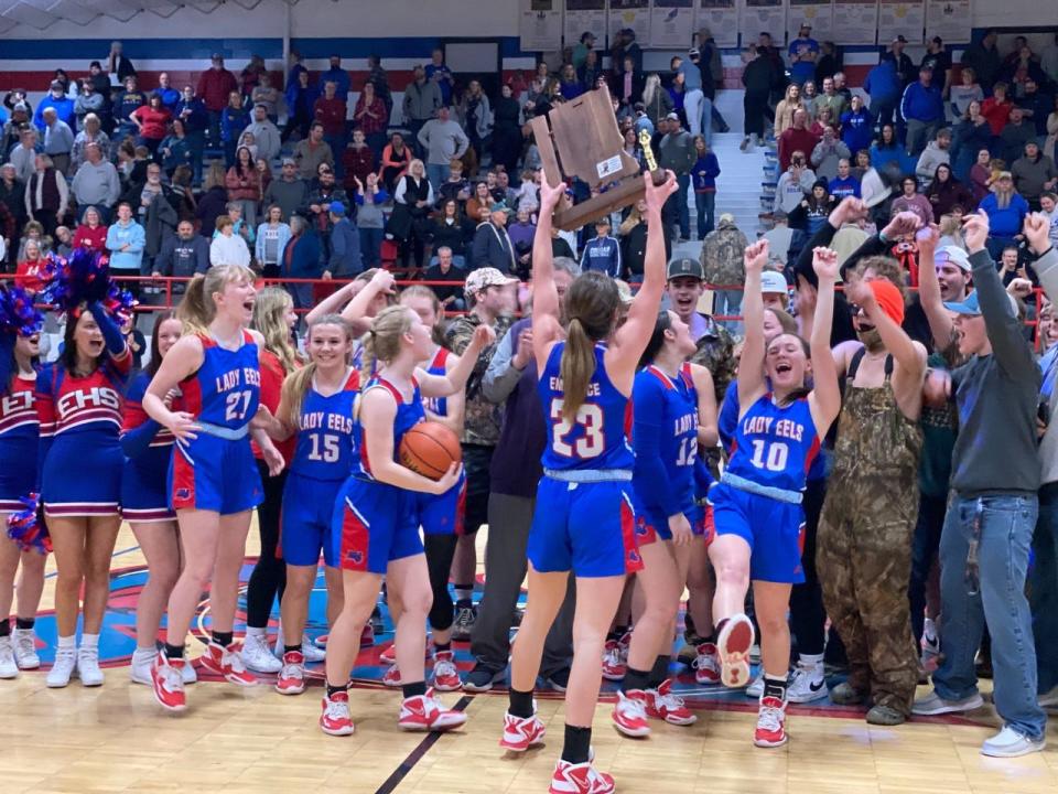 Eminence players celebrate after winning the program's first sectional championship since 1999, defeating Greenwood Christian on Feb. 4, 2023.