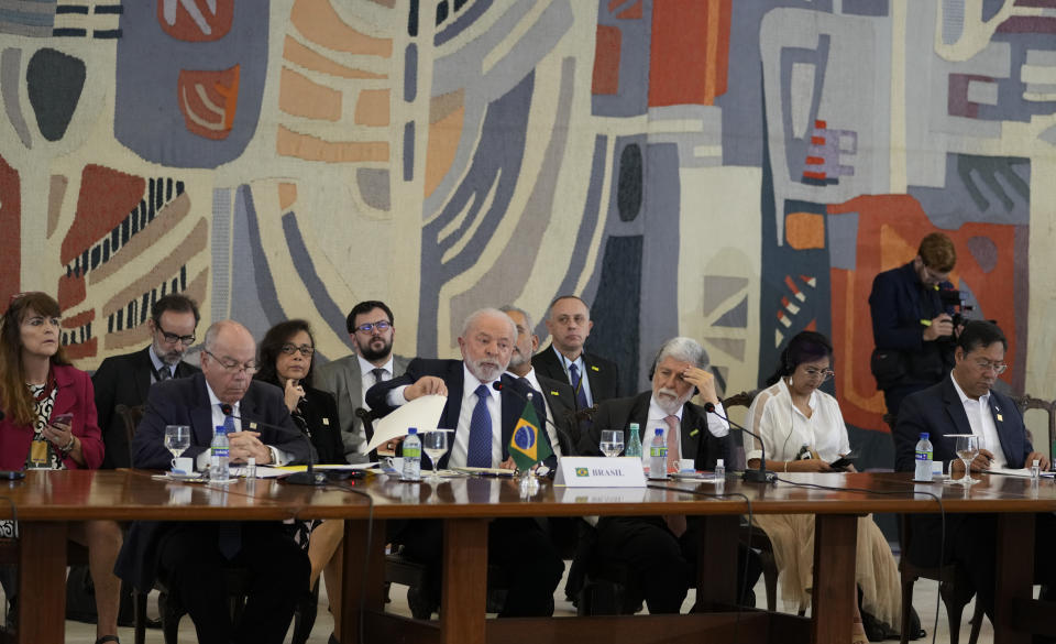 Brazilian President Luiz Inácio Lula da Silva, center, hosts leaders at the South American Summit at Itamaraty palace in Brasilia, Brazil, Tuesday, May 30, 2023. South America's leaders are gathering as part of Lula's attempt to reinvigorate regional integration efforts. (AP Photo/Andre Penner)