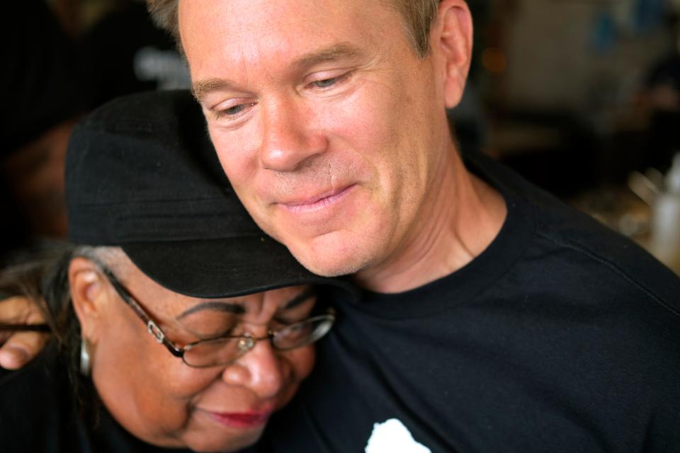 Oklahoma City Philharmonic Music Director Alexander Mickelthwate, right, hugs Marilyn Luper Hildreth during the reenactment of the 1958 Oklahoma City sit-in Saturday, August 20, 2022