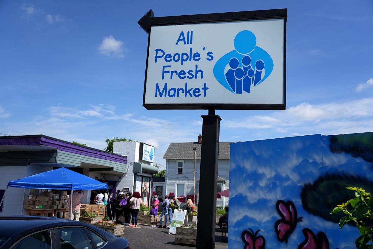 People wait in line June 8 at All People's Fresh Market, which provides free, fresh produce to any household earning less than 200% of the federal poverty guidelines. The market has provided free, fresh produce on Columbus' South Side since 2012.