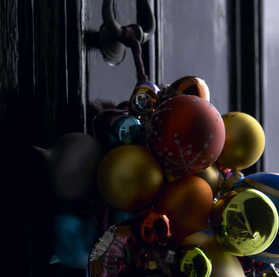 Hang a bunch of ornaments from your door knocker to give guests a festive welcome.