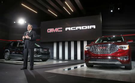 Mark Reuss, Executive VP, Global Product Development for GMC, introduces the 2017 GMC Acadia (L) and the Acadia Denali at the North American International Auto Show in Detroit, January 12, 2016. REUTERS/Mark Blinch