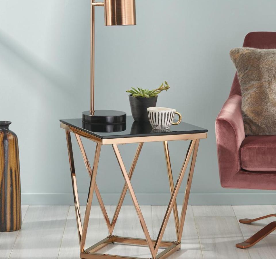 With a black glass top and rose gold frame, this side table is sure to stand out. It's just geometric enough and can hold everything from a lamp to your little succulents. Trust us, it looks a lot more expensive than its pricetag. <a href="https://fave.co/3iKFe3T" target="_blank" rel="noopener noreferrer">﻿Originally $134, get it now for $78 at The Home Depot</a>.