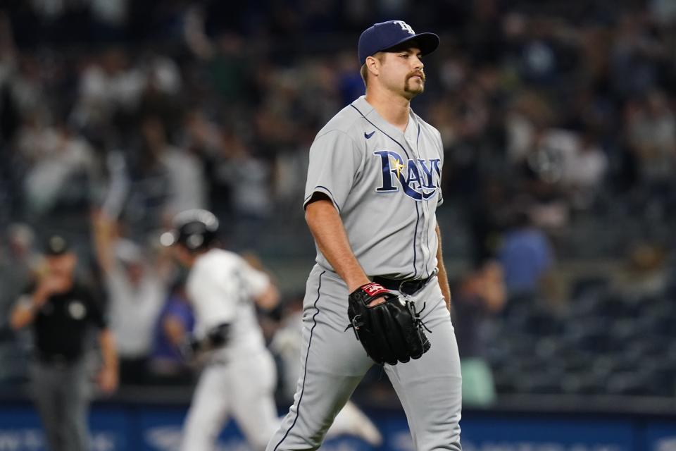 Tampa Bay Rays relief pitcher Jalen Beeks reacts as New York Yankees' Josh Donaldson runs the bases after hitting a walk-off grand slam during the 10th inning of a baseball game Wednesday, Aug. 17, 2022, in New York. The Yankees won 8-7. (AP Photo/Frank Franklin II)