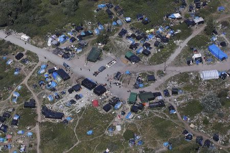 An aerial view shows a field named "new jungle" with tents and makeshift shelters where migrants and asylum seekers stay in Calais, northern France, July 21, 2015. REUTERS/Pascal Rossignol