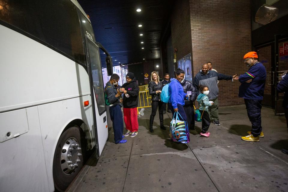 Kristian Gonzalez Perez gets his Border Patrol bracelet taken off by migrant rights activist Power Malu at the Port Authority bus terminal in New York City.