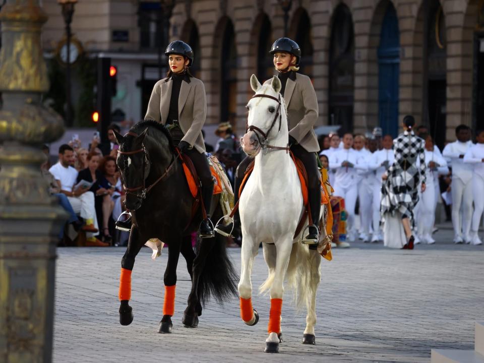 Kendall Jenner and Gigi Hadid ride horses on the runway at Vogue World 2024.