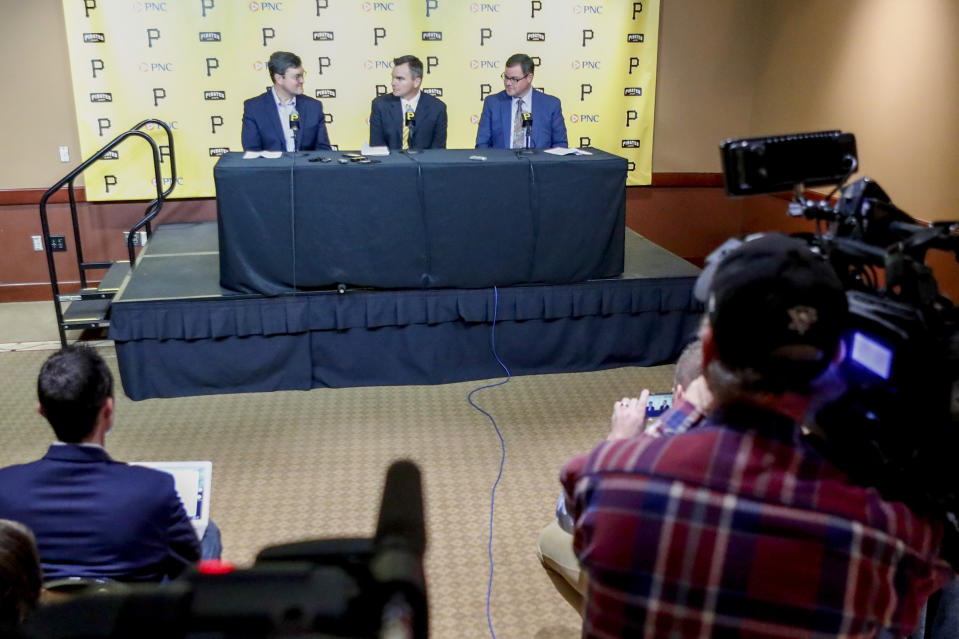 Ben Cherington, center, takes questions beside recently hired team president Travis Williams, right, and team owner Bob Nutting, left, during a news conference where Cherington was introduced as the new general manager of the Pittsburgh Pirates baseball team at a news conference, Monday, Nov. 18, 2019, in Pittsburgh. (AP Photo/Keith Srakocic)
