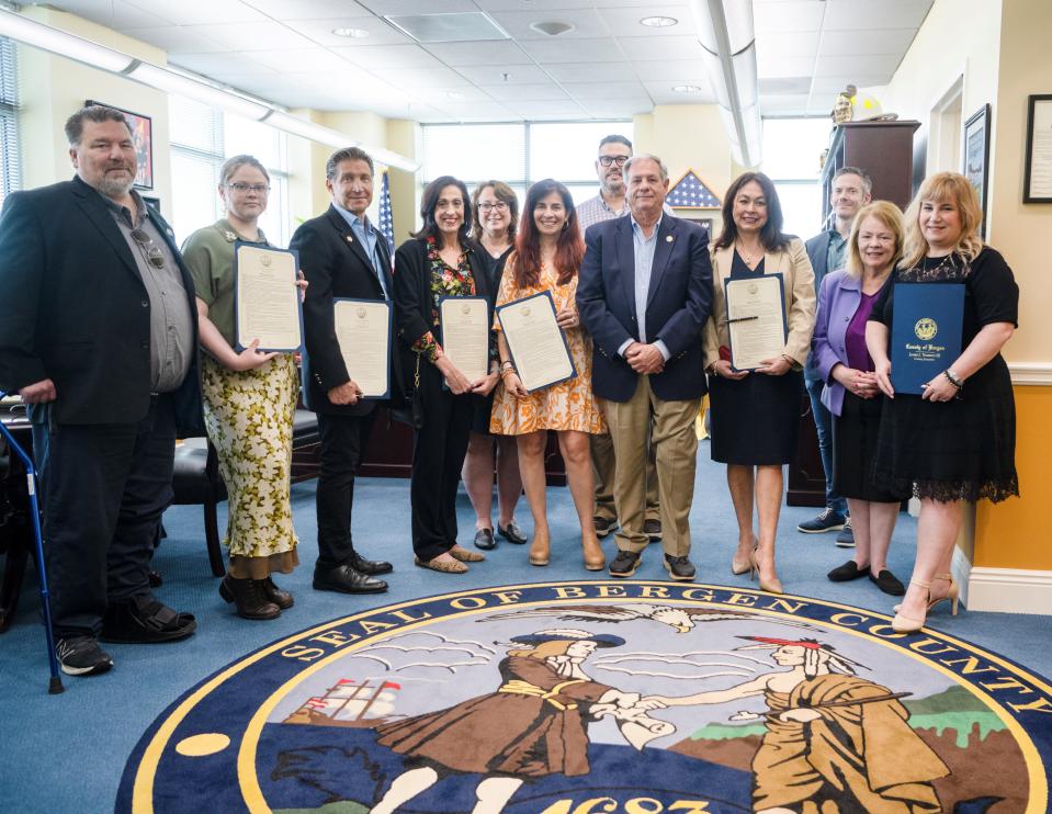 Inaugural members of the Age-Friendly Task Force stand with County Executive Tedesco and members of the Board of Commissioners.