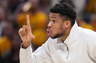 Milwaukee Bucks forward Giannis Antetokounmpo gestures on the bench during the second half against the Indiana Pacers in Game 2 in an NBA basketball first-round playoff series, Friday, April 26, 2024, in Indianapolis. (AP Photo/Michael Conroy)